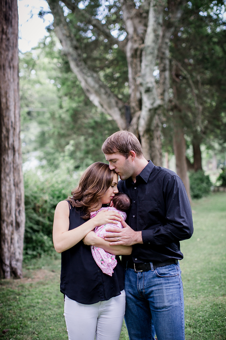 Kissing each other at this Tullahoma, TN newborn session by Knoxville Wedding Photographer, Amanda May Photos.