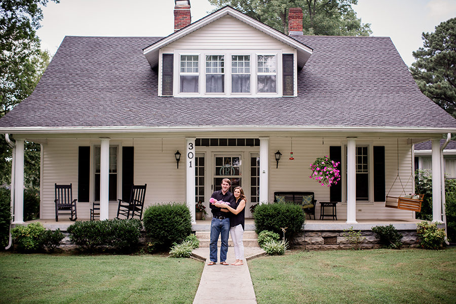 Standing in front of their house at this Tullahoma, TN newborn session by Knoxville Wedding Photographer, Amanda May Photos.
