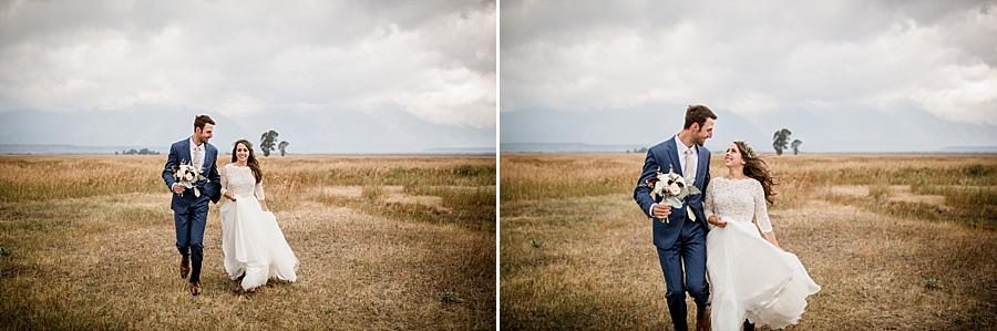 Walking in field at this Grand Tetons Destination Wedding by Knoxville Wedding Photographer, Amanda May Photos.