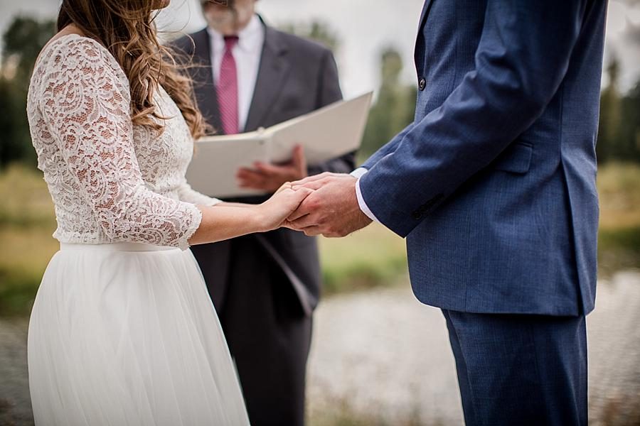 Close up of holding hands at this Grand Tetons Destination Wedding by Knoxville Wedding Photographer, Amanda May Photos.