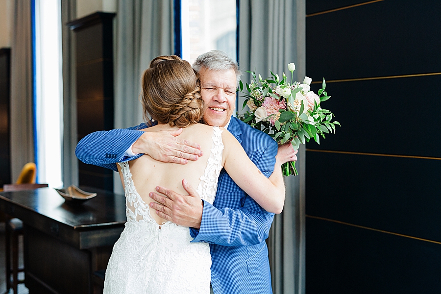 bride hugging dad at emporium wedding