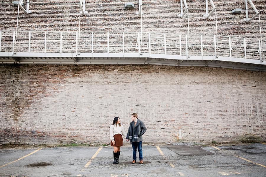 Couple holding hands in urban setting