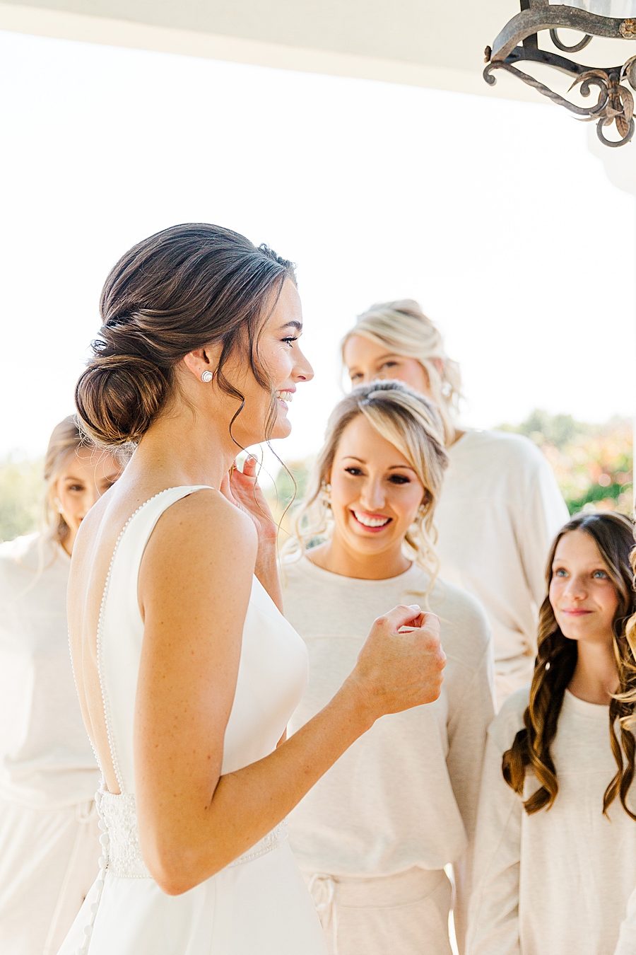 Bride with bridesmaids at this fall castleton farms wedding