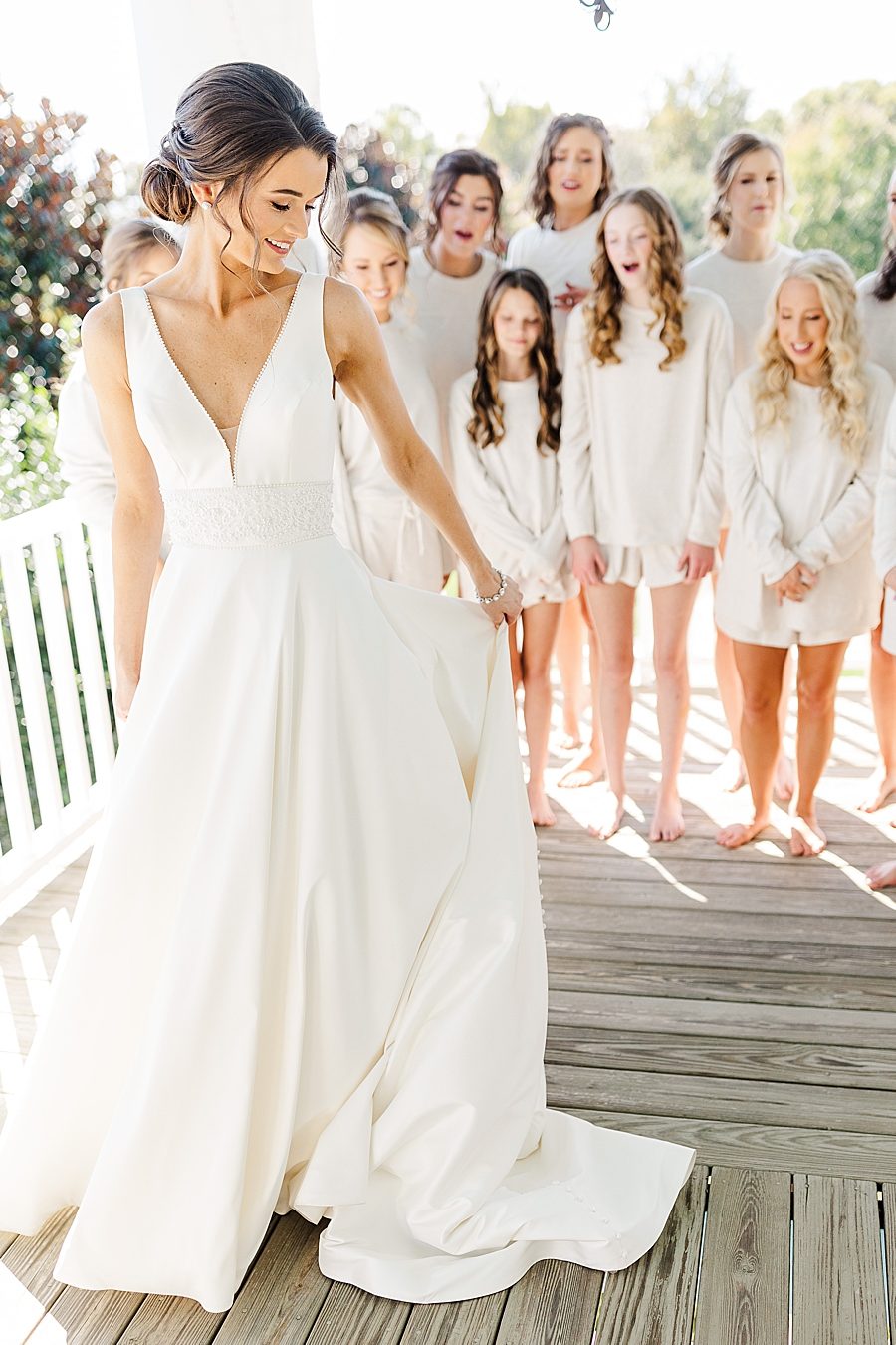 Bride twirling dress for bridesmaids at this fall castleton farms wedding