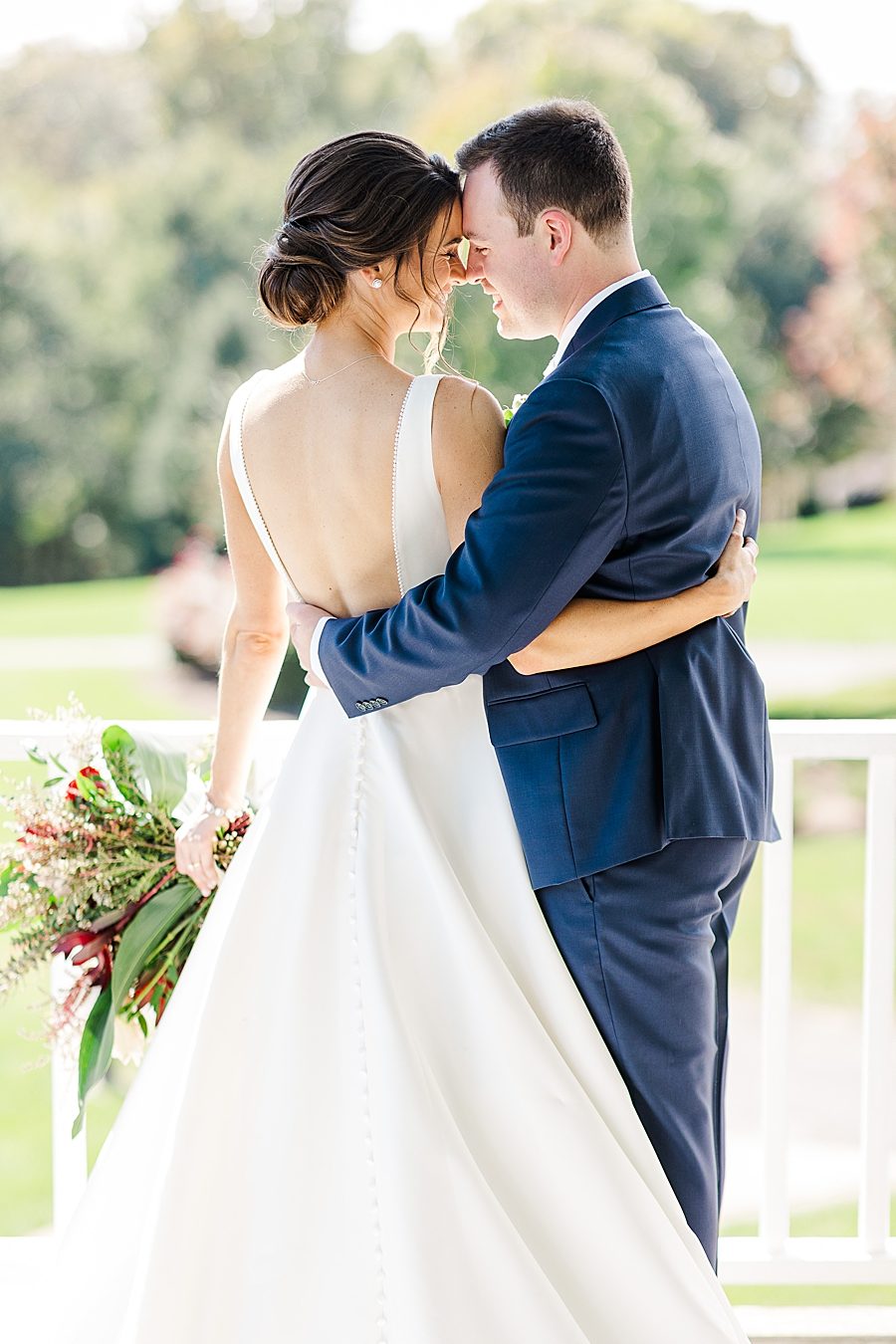 Foreheads together at this fall castleton farms wedding