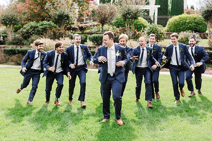 Groomsmen being silly at this fall castleton farms wedding