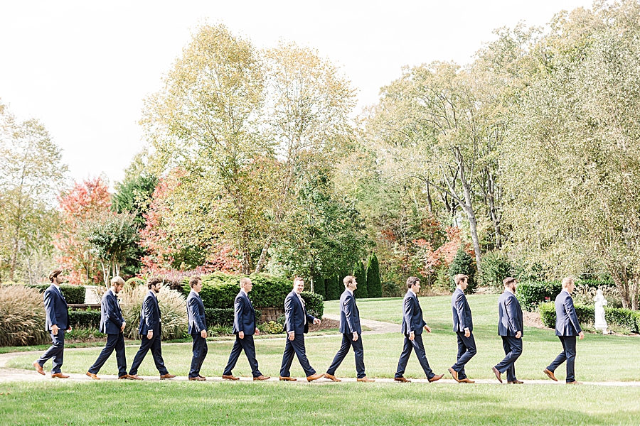 Guys walking together at this fall castleton farms wedding
