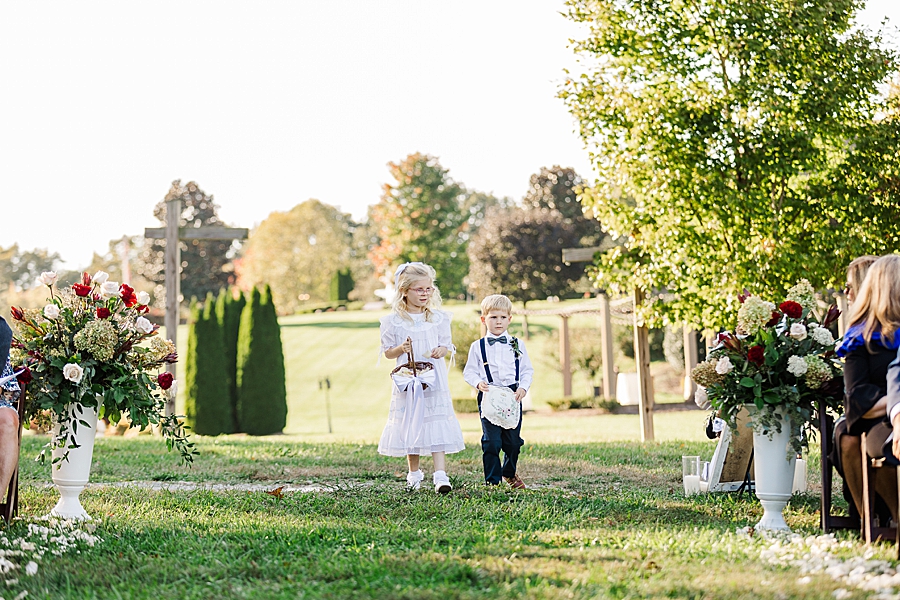 Flower girl and ring bearer at this fall castleton farms wedding