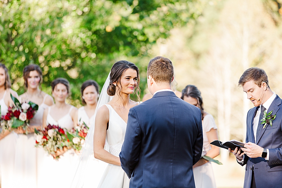 Exchanging vows at this fall castleton farms wedding