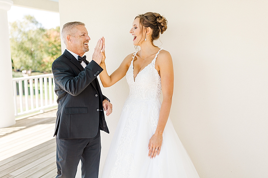 high five at this fall wedding at castleton farms