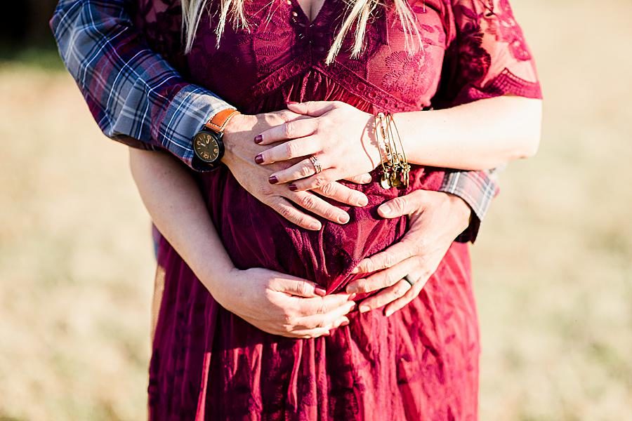 Hands on belly at this farm maternity session by Knoxville Wedding Photographer, Amanda May Photos.