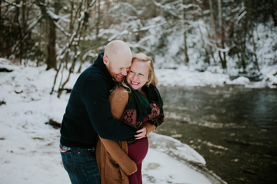  Knoxville, TN Smoky Mountain maternity photos, he bear hugs her from behind. 
