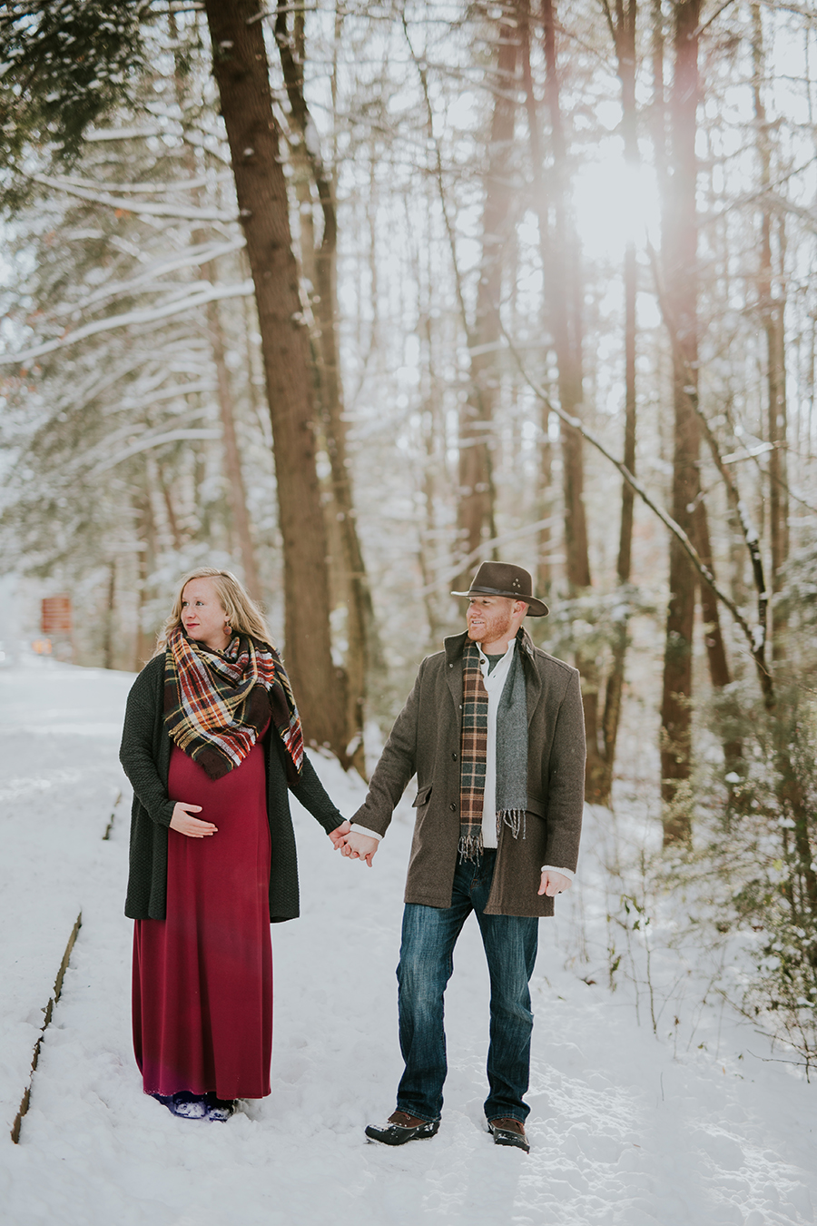  Knoxville, TN Smoky Mountain maternity photos, holding hands looking away.