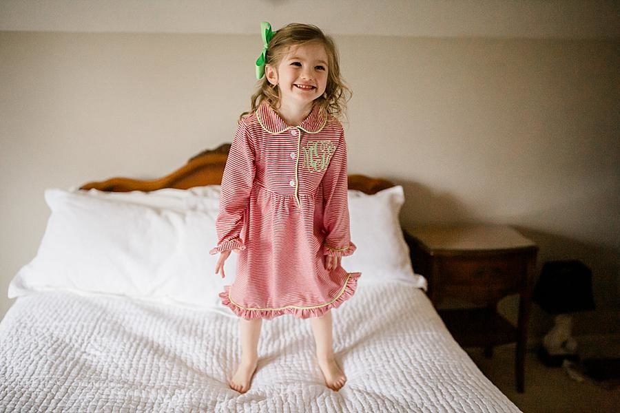Jumping on the bed at this Fox Den Session by Knoxville Wedding Photographer, Amanda May Photos.