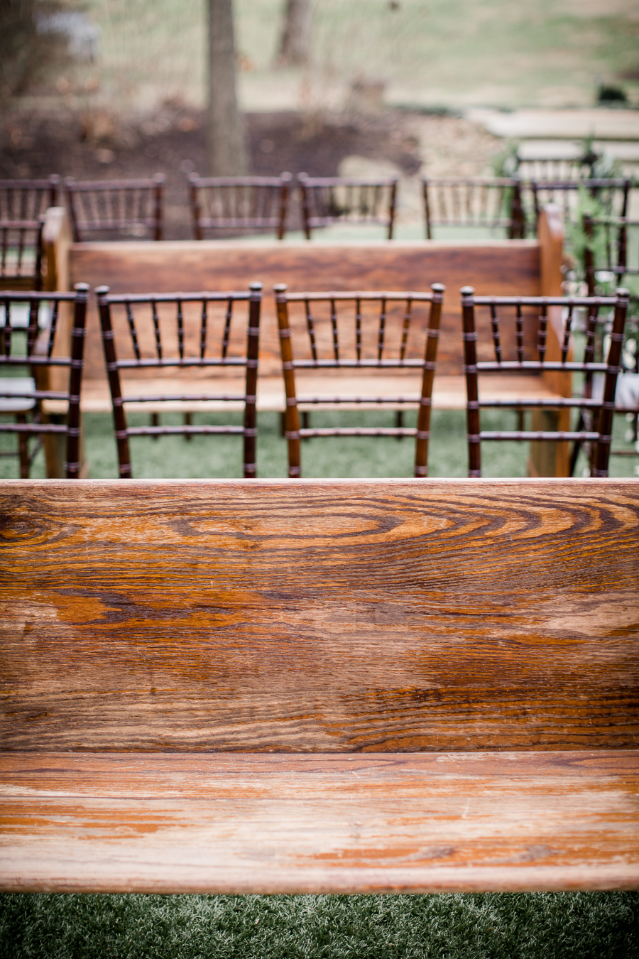 Church pew and wooden chairs at the open house of Knoxville Wedding Venue, Hunter Valley Farm, by Knoxville Wedding Photographer, Amanda May Photos.