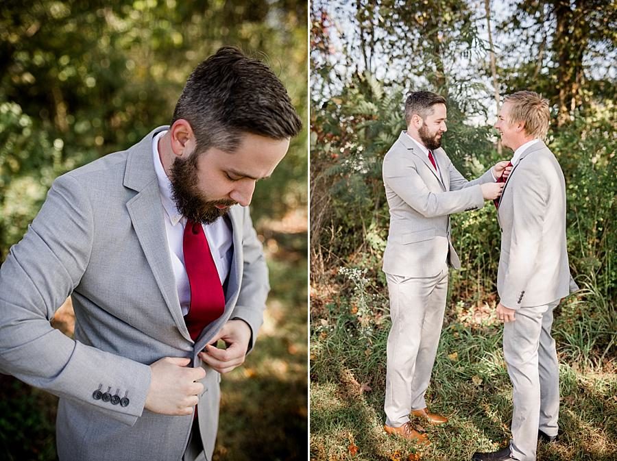 Straightening tie at this Toqua Campground Wedding by Knoxville Wedding Photographer, Amanda May Photos.