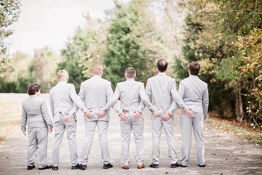 Holding butts at this Toqua Campground Wedding by Knoxville Wedding Photographer, Amanda May Photos.