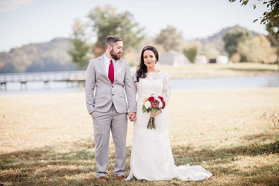 Holding hands at this Toqua Campground Wedding by Knoxville Wedding Photographer, Amanda May Photos.