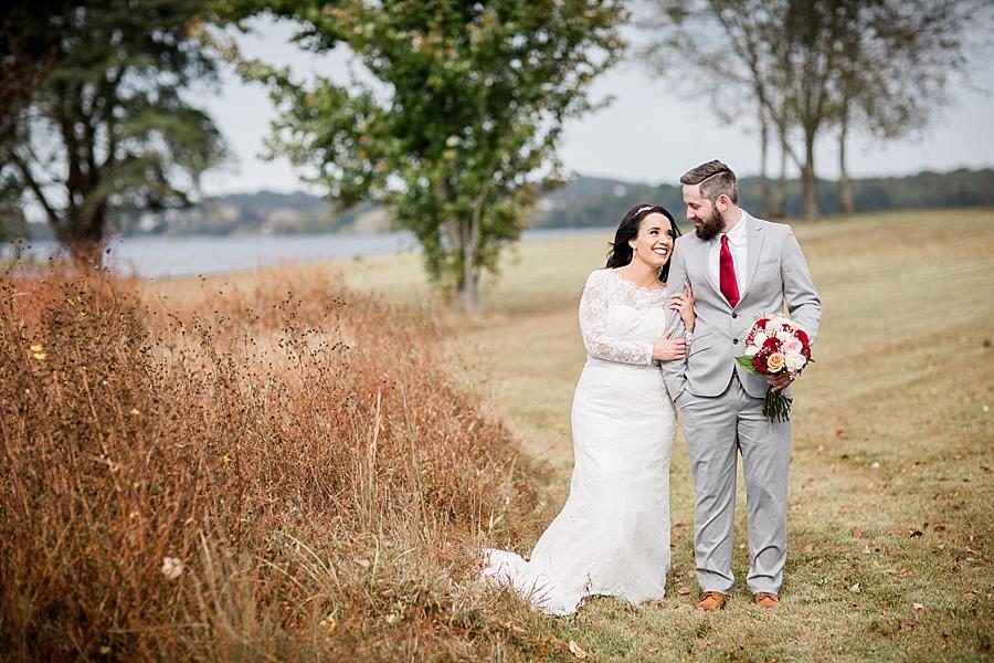 Arm in arm at this Toqua Campground Wedding by Knoxville Wedding Photographer, Amanda May Photos.
