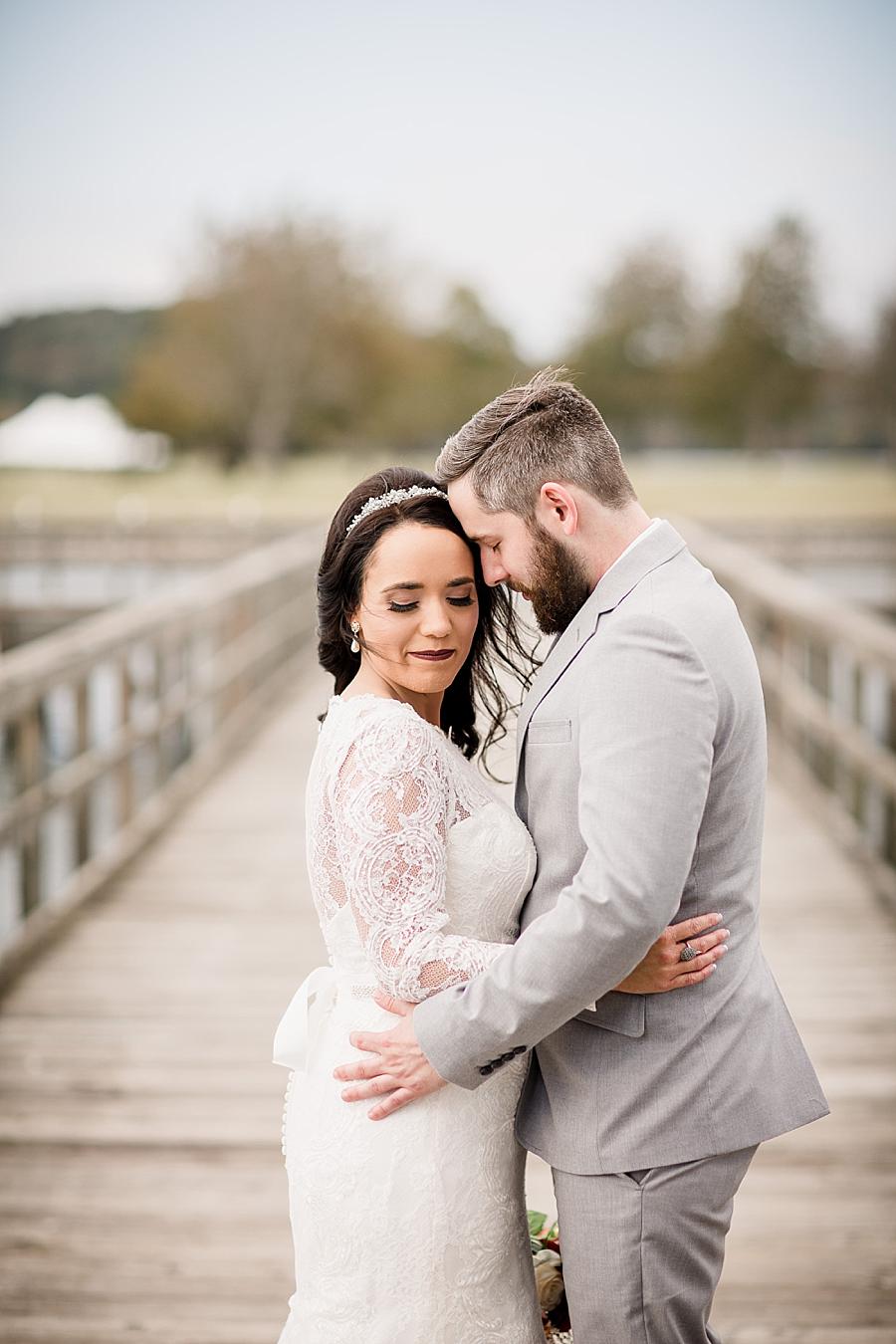 Arms around waist at this Toqua Campground Wedding by Knoxville Wedding Photographer, Amanda May Photos.
