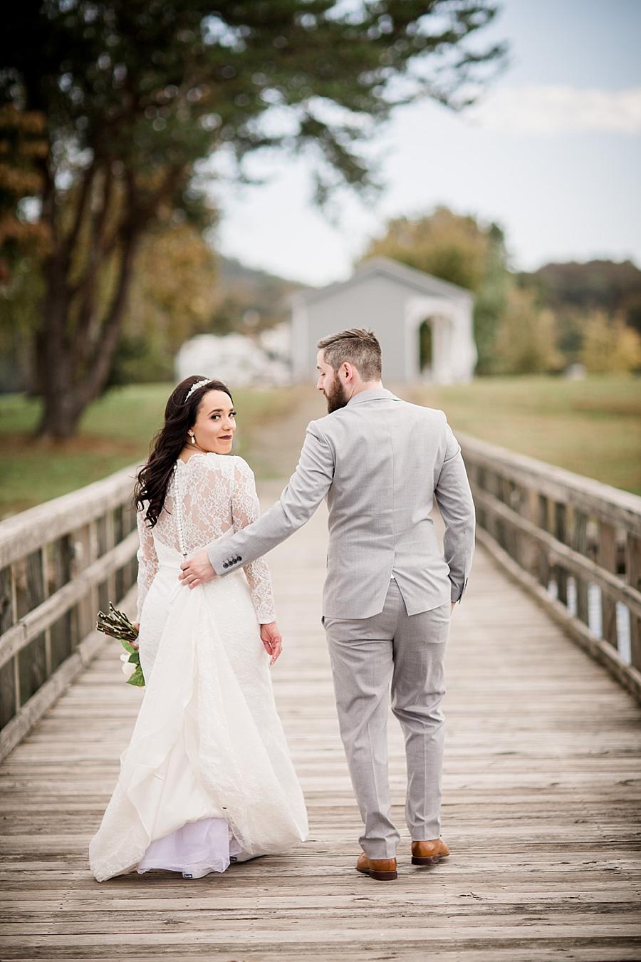 Walking together at this Toqua Campground Wedding by Knoxville Wedding Photographer, Amanda May Photos.