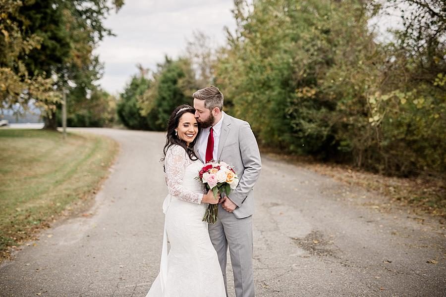 Temple kiss at this Toqua Campground Wedding by Knoxville Wedding Photographer, Amanda May Photos.