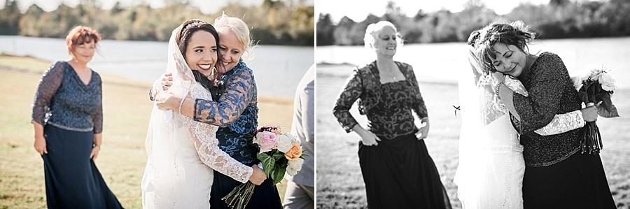 Hugging guests at this Toqua Campground Wedding by Knoxville Wedding Photographer, Amanda May Photos.