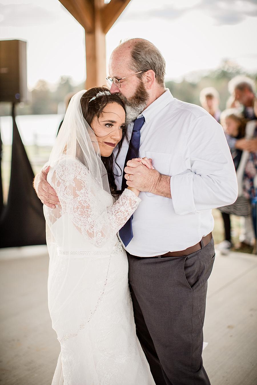 Kiss on top of the head at this Toqua Campground Wedding by Knoxville Wedding Photographer, Amanda May Photos.