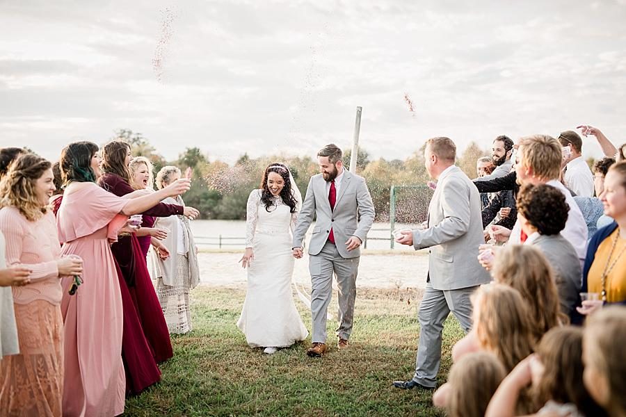 Sprinkle exit at this Toqua Campground Wedding by Knoxville Wedding Photographer, Amanda May Photos.