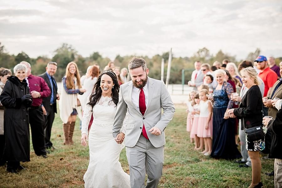 Running away together at this Toqua Campground Wedding by Knoxville Wedding Photographer, Amanda May Photos.