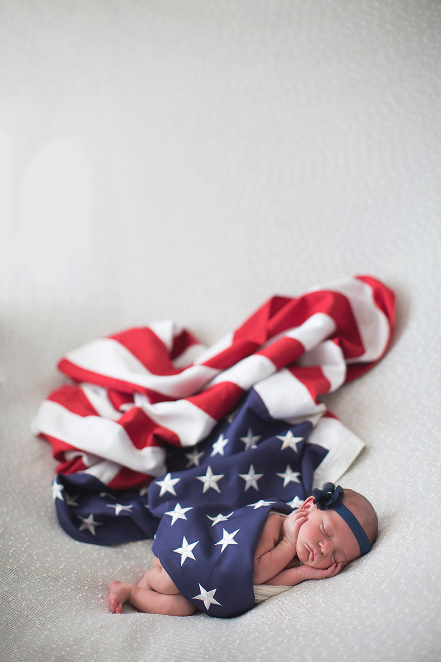 Wrapped in an American Flag at this American Flag newborn session by Knoxville Wedding Photographer, Amanda May Photos.