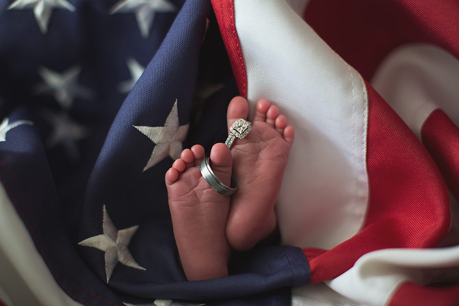 Feet with mom and dad's rings on her toes at this American Flag newborn session by Knoxville Wedding Photographer, Amanda May Photos.