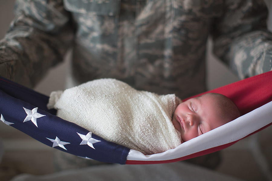 Laying swaddled on the flag at this American Flag newborn session by Knoxville Wedding Photographer, Amanda May Photos.