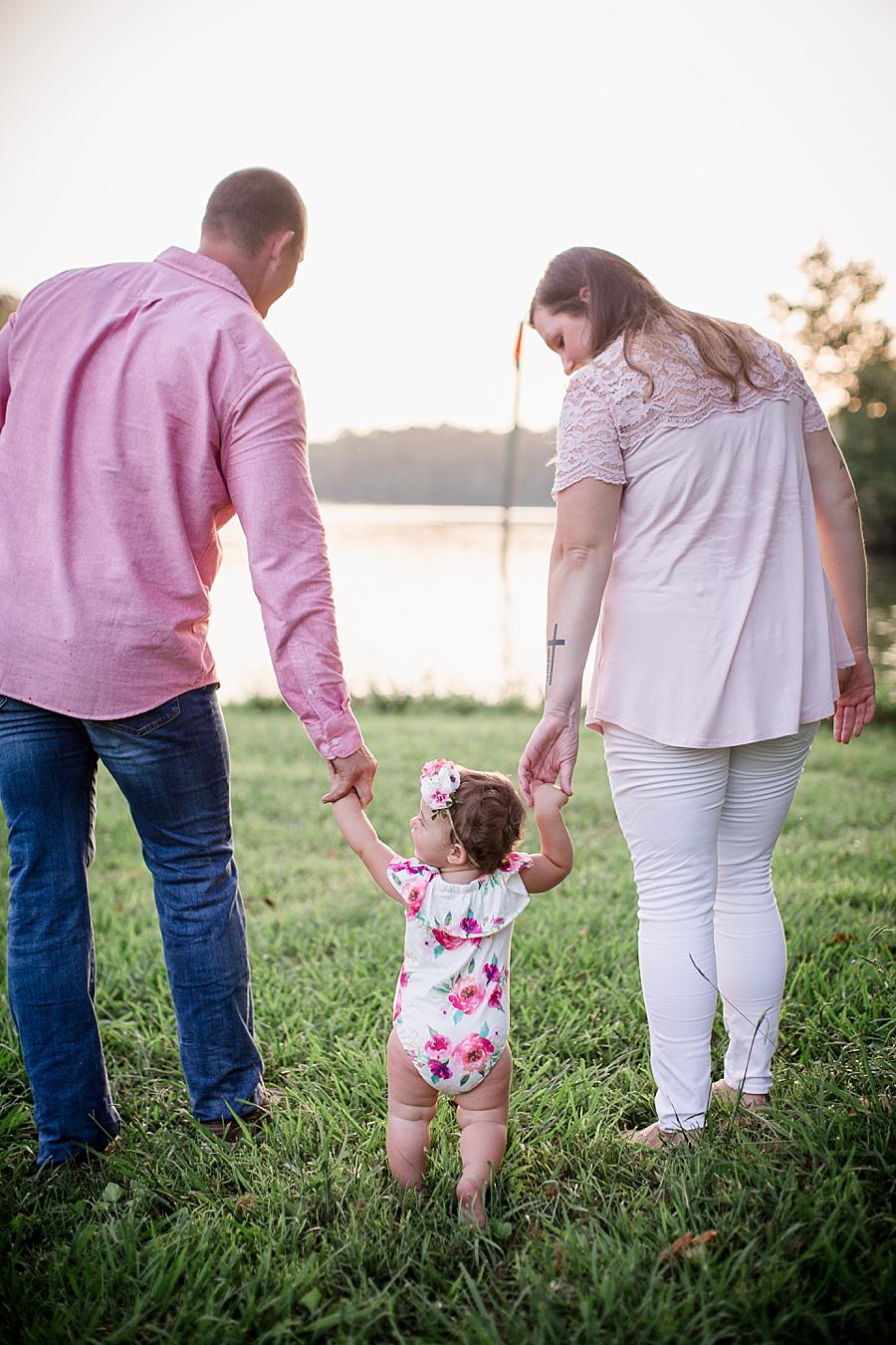Holding hands at this Melton Lake Park One Year Session by Knoxville Wedding Photographer, Amanda May Photos.
