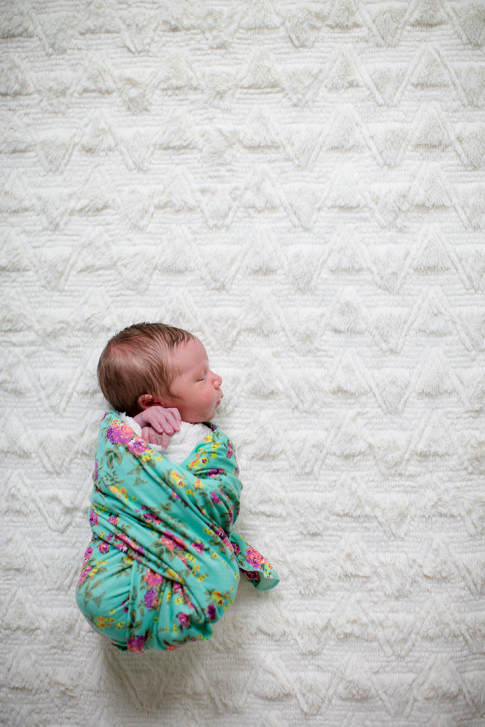 Floral swaddle on her back at this newborn session by Knoxville Wedding Photographer, Amanda May Photos.