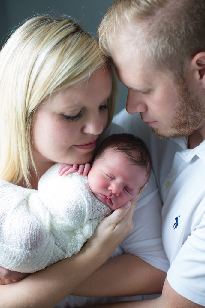 Mom dad and baby at this newborn session by Knoxville Wedding Photographer, Amanda May Photos.