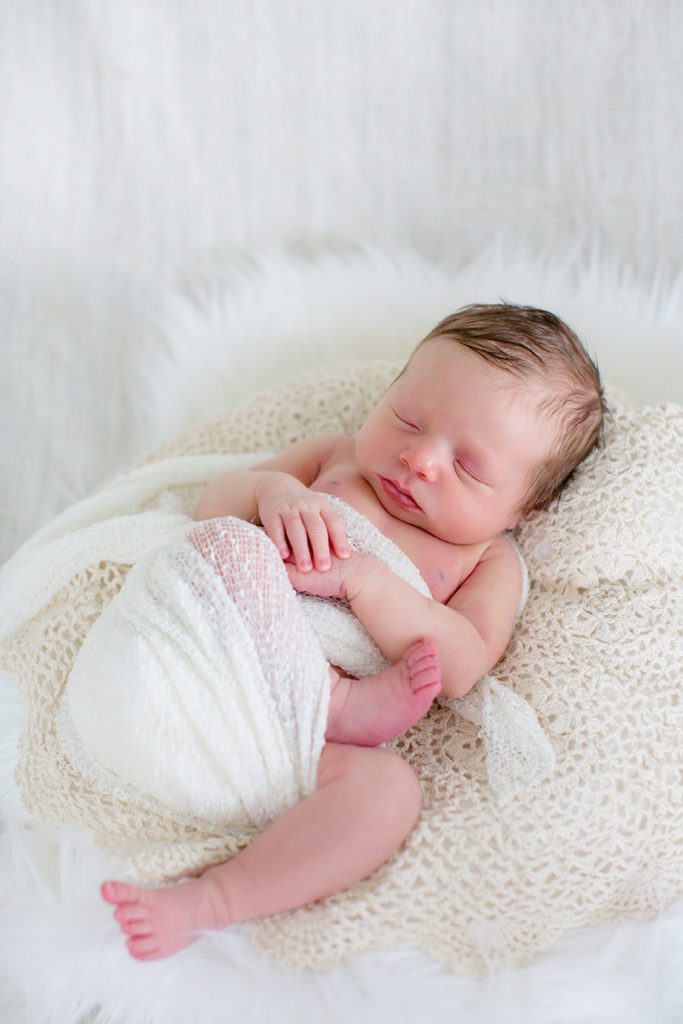 Partial swaddle on newborn at this newborn session by Knoxville Wedding Photographer, Amanda May Photos.