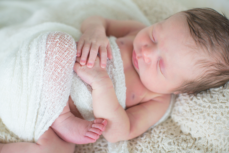 Hands resting on newborns tummy at this newborn session by Knoxville Wedding Photographer, Amanda May Photos.