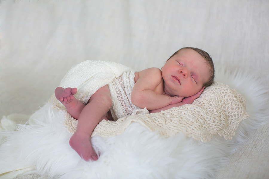 Hands folded under cheek at this newborn session by Knoxville Wedding Photographer, Amanda May Photos.