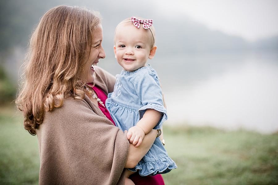 Mom holding toddler at this Melton Hill Park Sunrise Session by Knoxville Wedding Photographer, Amanda May Photos.