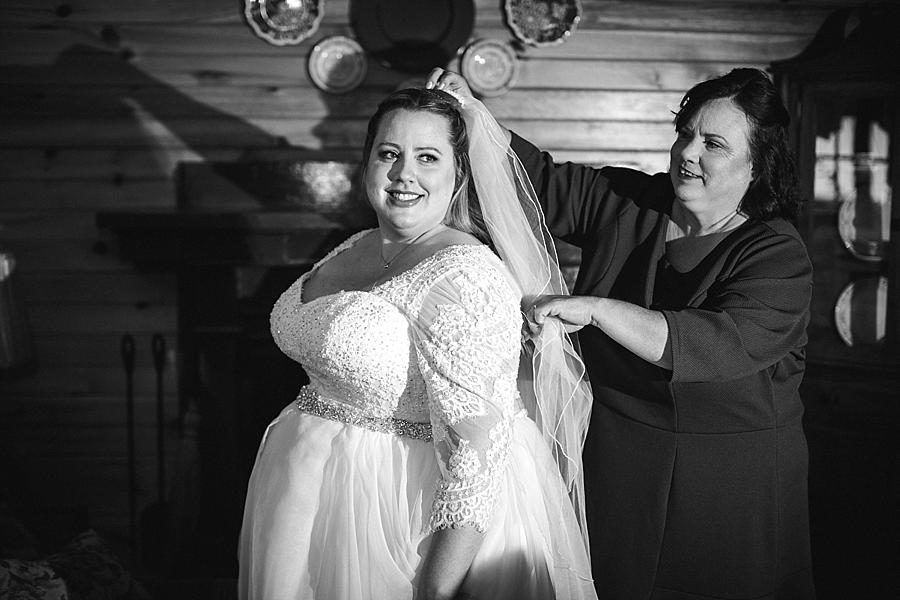 Putting on the veil at this Sampson's Hollow Fall Wedding by Knoxville Wedding Photographer, Amanda May Photos.