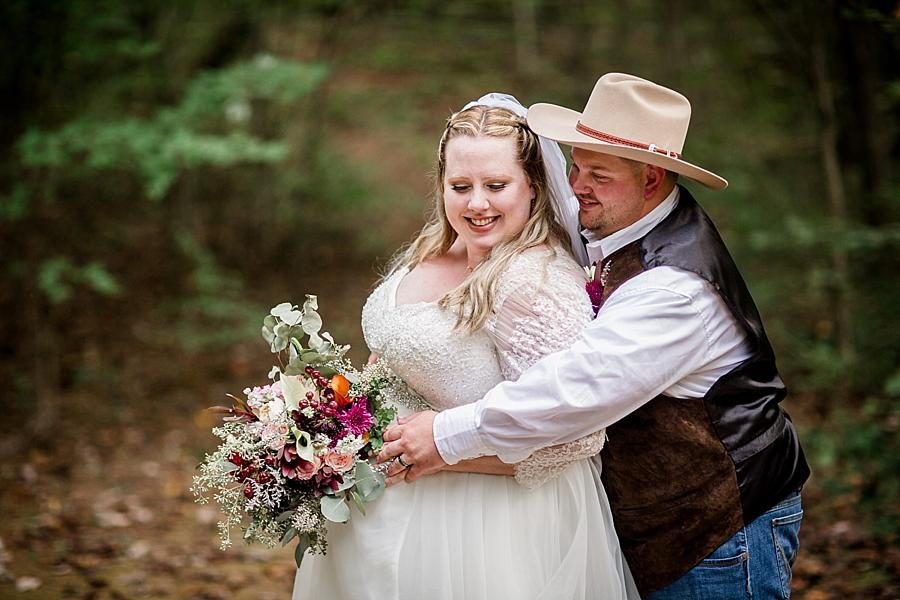 Arms wrapped around waist at this Sampson's Hollow Fall Wedding by Knoxville Wedding Photographer, Amanda May Photos.