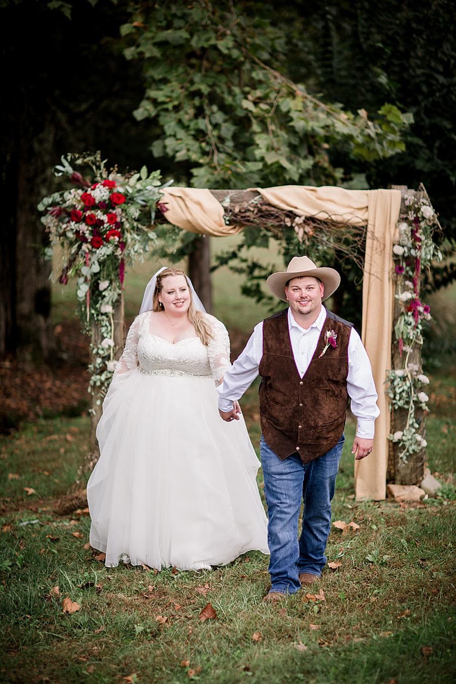 Holding hands at this Sampson's Hollow Fall Wedding by Knoxville Wedding Photographer, Amanda May Photos.