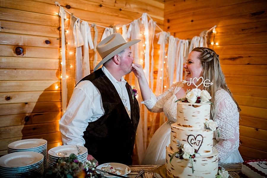 Cutting the cake at this Sampson's Hollow Fall Wedding by Knoxville Wedding Photographer, Amanda May Photos.