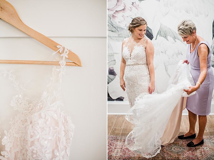 Fluffing wedding dress at this Hunter Valley Pavilion wedding by Knoxville Wedding Photographer, Amanda May Photos.