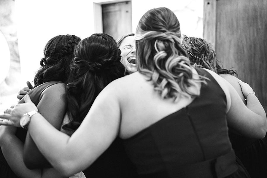 Hugging bridesmaids at this Hunter Valley Pavilion wedding by Knoxville Wedding Photographer, Amanda May Photos.