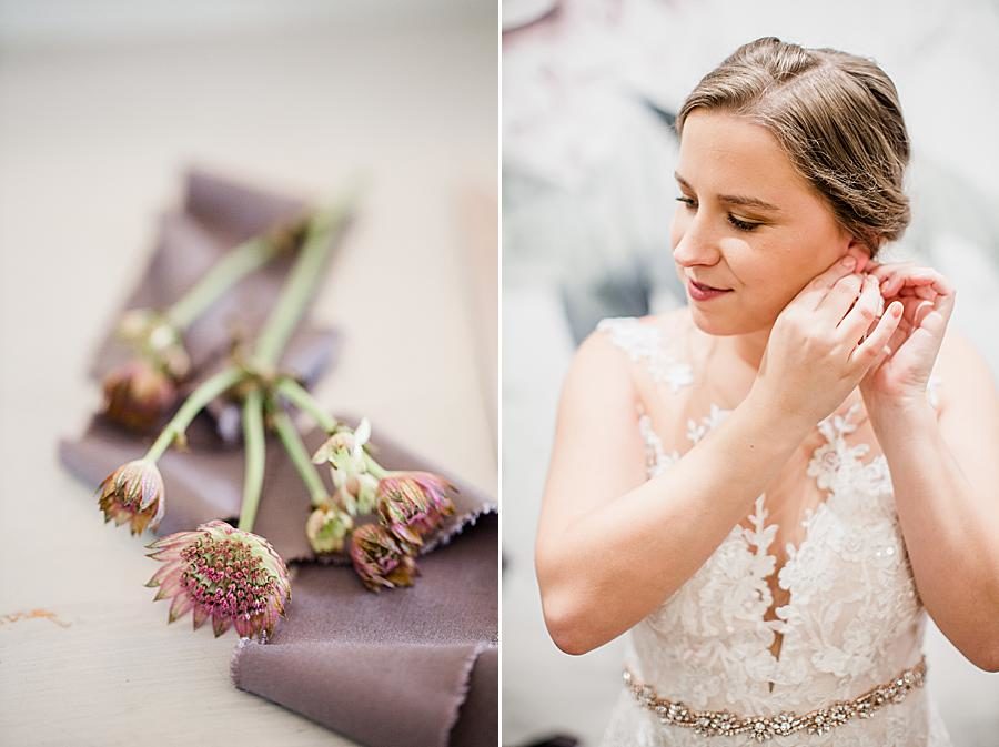 Putting on earrings at this Hunter Valley Pavilion wedding by Knoxville Wedding Photographer, Amanda May Photos.