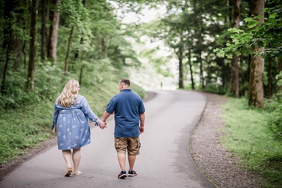 Walking down the road at this Cades Cove Engagement by Knoxville Wedding Photographer, Amanda May Photos.
