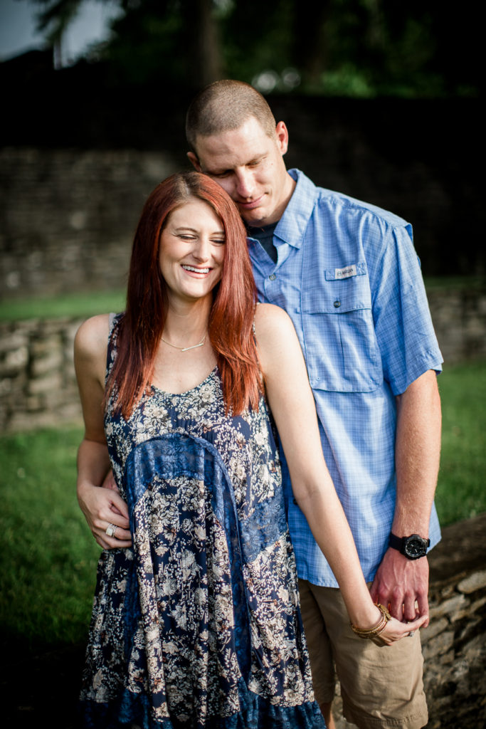 Coming close to her from behind at this Knoxville Botanical Gardens engagement session by Knoxville Wedding Photographer, Amanda May Photos.