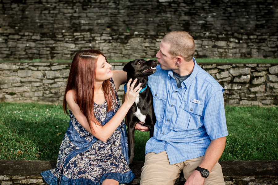 Playing with their puppy at this Knoxville Botanical Gardens engagement session by Knoxville Wedding Photographer, Amanda May Photos.